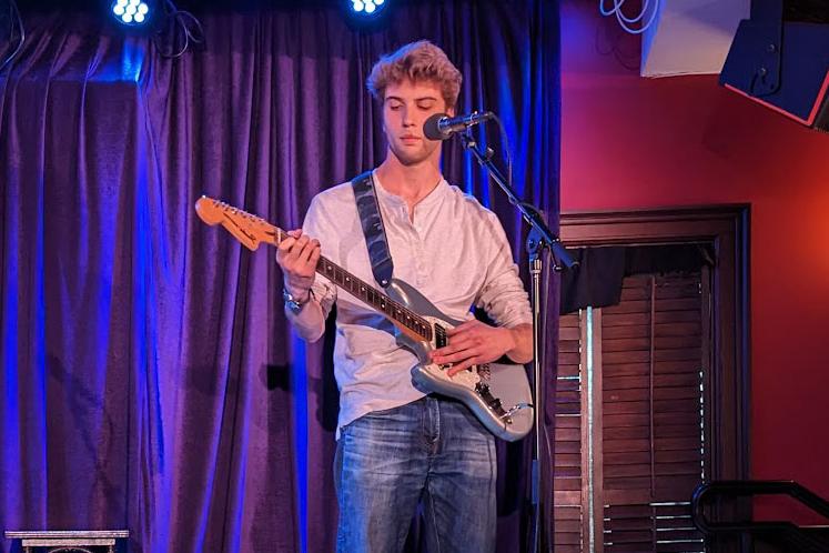 A student performs at Caffe Lena as part of Distinguished Artist-in-Residence Joel Brown